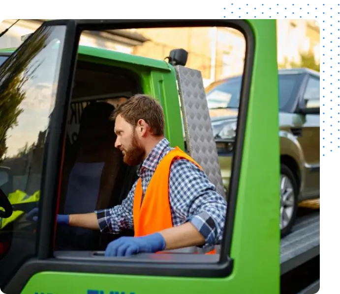 Man getting into Green Truck
