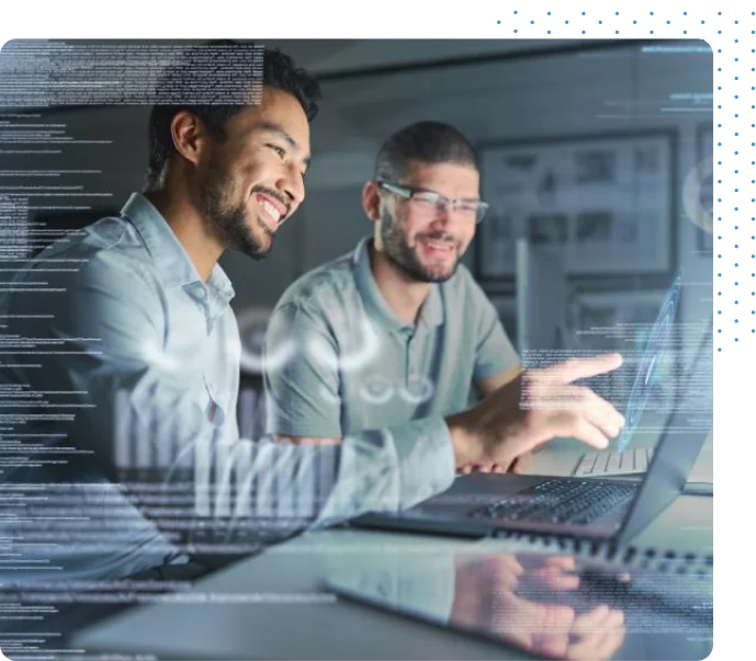 Two men looking at a laptop